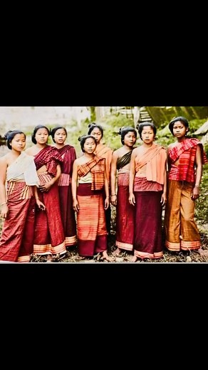 Let me introduce you to a treasured image from the past, featuring the elegant women of Southern Laos. This historic photograph vividly captures their daily lives and festive dance traditions, providing a unique window into the region's fascinating history and customs. | Oun Thavonekham
