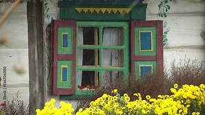 Ancient Window in Old House Beautiful old house window. View from the street.