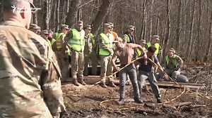 Mourners gathered at the US Embassy in Lithuania on April 1 to honor four American soldiers who died after their M88 Hercules armored recovery vehicle became submerged in a peat bog during a training exercise. | Radio Free Europe/Radio Liberty