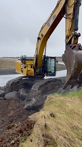 A CAT 349F excavator loading large rocks into a Scania tipper in Iceland. | RPA Media
