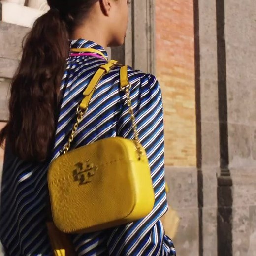 The McGraw Camera Bag Crafted in pebbled leather with hand-sewn pick stitching Shop now torybur.ch/McGraw | TORY BURCH