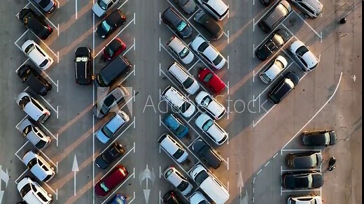 Aerial view of the car and parking lot. Photo from a drone. Markings on the pavement. Transportation and infrastructure. An aerial view of transportation. The city and transportation.