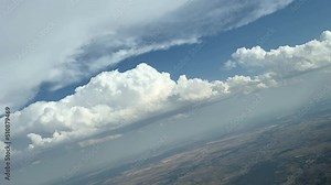 Cockpit view. Pilot POV during a right turn maneuver to avoid bad weather clouds ahead in a extremely hot and hazy atmosphere. Daylight. 4k