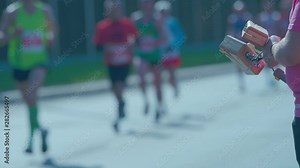 Man cheering marathon runners.
