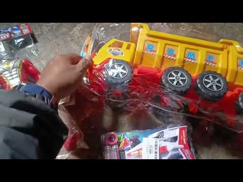 Unboxing the yellow tow truck and red Ultraman toys