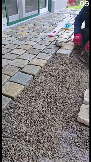 Laying paving stones with precision and care