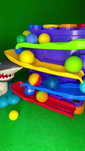 Toy Balls Sliding in Slow Motion
