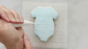 Watch How-to Decorate the Baby Onesie cookie on Amazon Live