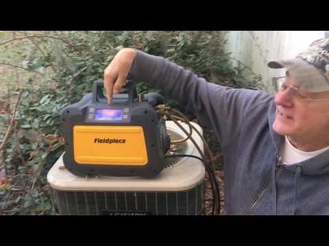 Fieldpiece MR45 recovery unit recovering refrigerant from an air conditioner.