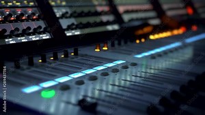 Remote control for adjusting the sound. Audio mixer. Sound engineer adjusts the sound. Music Festival. Change the volume level. Recording studio. Shooting a television show, a concert. Live broadcast.