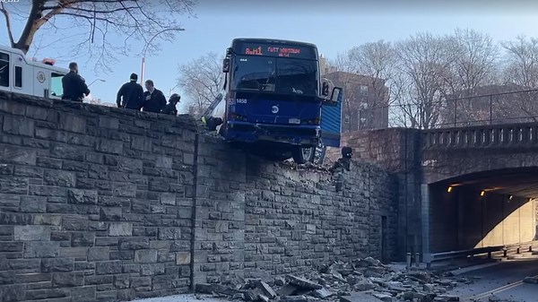Front of MTA bus hangs off overpass after crash into guardrail in Bronx