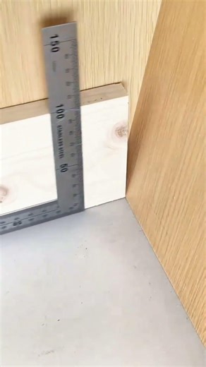 Green pencil marks wood—steel edge guides, hand measures twice, cut waits.