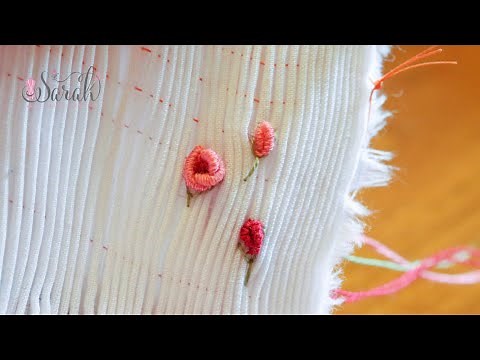 Sewing bullion roses on top of smocking pleats