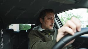 Nervous driver tapping fingers on car steering wheel while waiting, 4K