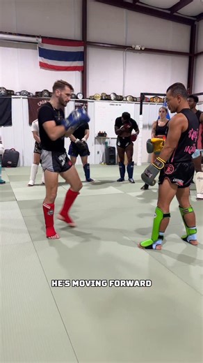 Forward pressure is only a problem… if you don’t know how to use it against them Here’s how this works: As your opponent pressures forward, move back slowly to bait them in. Then take a small step back - switching to southpaw. The moment your foot lands, explode into a straight left. That straight left does two things - it breaks their rhythm and hides what comes next. From there, follow with either a left knee or left kick depending on the distance. The change of pace from slow to explosive thr