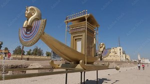 Golden chariot on sphinx avenue, Luxor, Egypt. Ancient Egyptian litter vehicle