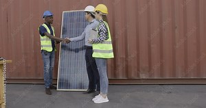 Energy Concept. Businessman talking to engineers about planning to install solar panels 4k video