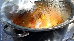 Cooking with sun energy, parabolic solar oven in the middle of cooking a dish thanks to solar energy