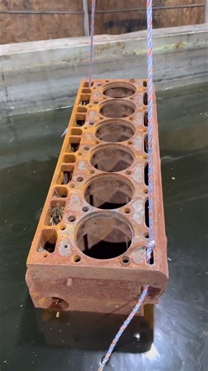 Before and after acid dipping an International Harvestor tractor engine block to remove all the rust