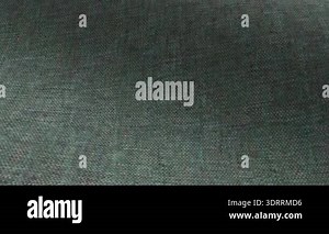 Green fabric background. Green cloth waves background texture. Green fabric cloth textile material.