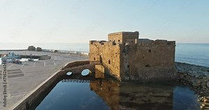 Exploring Paphos, Cyprus: Aerial View of the Historic Stone Castle Fort by the Sea, Offering a Glimpse into the Past. High quality 4k footage