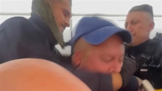 Police forcibly remove British men on stag do off Ryanair flight
