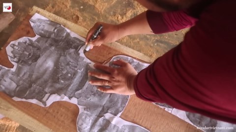 Watch a giant mech rise from solid wood