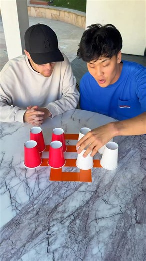 Turned Cup Stacking Into A Game Of Chess… | Jojo Sim