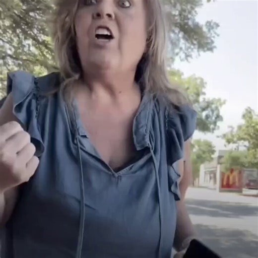 MAGA mama takes license plate photo to send ICE of door dash driver who's not speaking English—"You're taking away our jobs!""You're illegal... why are you entitled to be here with a illegal car?" woman yells."Go speak your language back in Mexico!"She seems to be confused about exactly who she hates—the driver asks her if she is an "Islamophobe"—yet she continues to tell her to "go back to Mexico."The incident occurred in a fast food parking lot in Flower Mound, Texas—about 20 miles northwest o