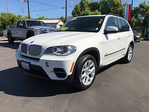 FAST, SPORTY AND LUXURIOUS!! 2013 BMW X5 XDrive 35i AWD Powered by a 3.0L Twin Turbo 6-Cyl. Paired with a 8-Speed SportTronic Loaded with the convenience pkg., power liftgate release, Keyless entry and start, Navigation, Bluetooth, BMW assist, Parking sensors, Dual power Heated Leather seats, third row seating and much more! STK#: 2930, VIN#: B09533 ONLY 71,000 MILES!! DISCOUNTED TO ONLY $27,495!! For Pre-approval and more information Call us at (530)251-0101 , Come see us at 1303 main st. , VEH