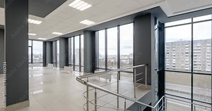 loop rotation and panoramic view in empty modern hall with columns, doors and panoramic windows overlooking the city.