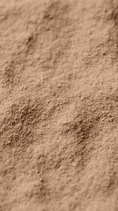 Zoom frame chocolate colour protein, whey powder, rotation. Bodybuilding, fitness and gym lifestyle. sstkVertical