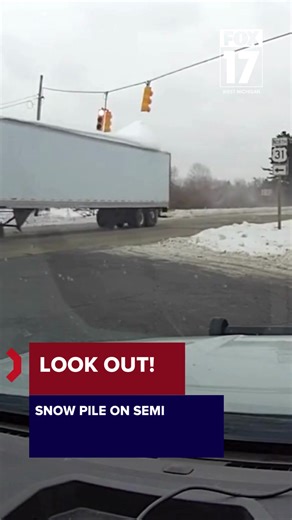 Traffic Signal Damaged by Snow-Covered Semi Trailer