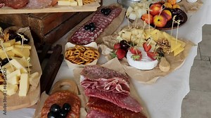 Snack table. Catering at the banquet, fruits, cheeses and cold cuts. Table with colorful snacks, no people.
