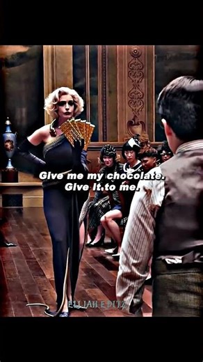 The bald woman in the image is Anne Hathaway, playing the Grand High Witch shouting "Quiet!"..!