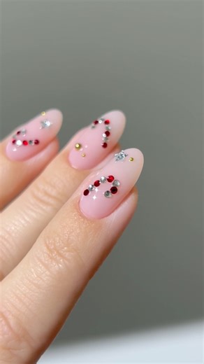 10K views · 142 reactions | ♥️☁️ Rhinestone candy canes for a dazzling twist on festive nails ⭐️✨Ring @mariejunejewelry Discount code: heygreatnails-MJ || *all products are linked on my amzn in the bio || (*aff) #winternails #holidaynails #sparklynails #nailinspo #christmasnails #rednails #candycanenails #xmasnails #rhinestonenails #naturalnails #naildesigns #nailsoftheday #nailsnailsnails | Heygreatnails | Facebook