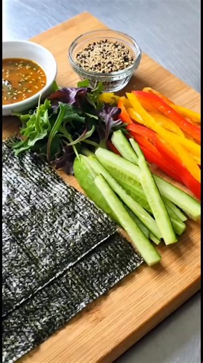 Raw veggie wrap. Roast is seaweed wrapped around baby greens, cucumber, bell peppers and avocado. with a sweet and savory wasabi dipping sauce. Indulge in our delicious plant-based cuisine: * Allergen-friendly alternatives to your favorite dishes * Customize any meal to fit your needs and wants! * Catering, Meal Prep & Event Services available too! Order now: 🍳 Weekly Meal Prep: https://www.veganmami.com/mealprep/ 📊 For pickup: https://www.foodbooking.com/api/fb/6l7_xr 💻 For delivery: https:/