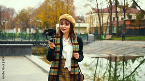 Popular influencer live streaming from park using steadicam and smartphone