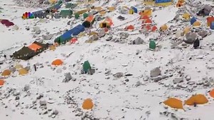 NBC flies over Mount Everest base camp, where a white track of snow offers chilling evidence of the avalanche that ripped down the world's highest mountain and left at least 18 climbers dead in its wake. Story here: http://nbcnews.to/1P5ZzLn | NBC News