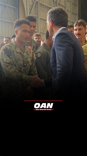 Secretary of War Pete Hegseth shakes hands with U.S. service members