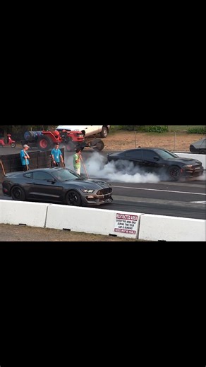 6.6K views · 203 reactions | 2017 Shelby GT350 vs Dodge Charger Hellcat – Modern Muscle Icons Face Off in a High-Rev Battle of Speed, Sound & Pure Adrenaline #ShelbyGT350 #DodgeHellcat #MuscleCarBattle #CarEnthusiasts #DragRaceNation #AmericanMusclePower #DragRacing | Wheels | Facebook