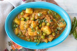 Aloo Matar Sabzi Recipe is a very traditional North Indian dish that is made with potatoes and peas, simmered in light and tangy tomato gravy. The recipe has a delicate addition of spices to the potatoes in a tangy tomato gravy, simmered to perfection brings out the essence of this flavorful dish. Serve along with steamed rice, parathas, phulka's or naan for a perfect weeknight dinner. Recipe Link: http://www.archanaskitchen.com/aloo-mutter-ki-sabzi-potatoes-and-peas-in-tomato-curry | Archana's 