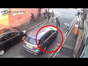 Surveillance Camera Footage Captures Gang Drive-by Shooting In Manchester, England