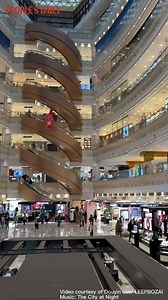 The stunning curved escalator installed at a shopping mall in east China's Shanghai gives shoppers an amazing yet a bit dizzying experience. | People's Daily, China