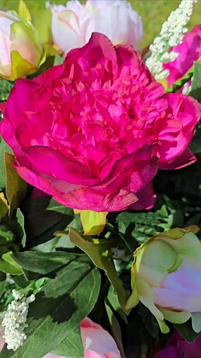 A closer look at one of our beautiful memorial headstone saddles 🌷🌷 #memorialflowers #headstoneflowers #cemeteryflowers #graveflowers #flowersforheadstone | Martin's Floral & Home Decor