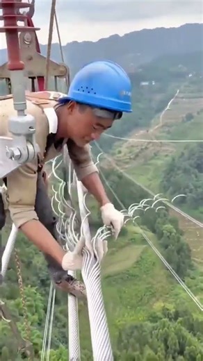 Installing Cable Spacers Manually on High Voltage Lines for Professional Electricians