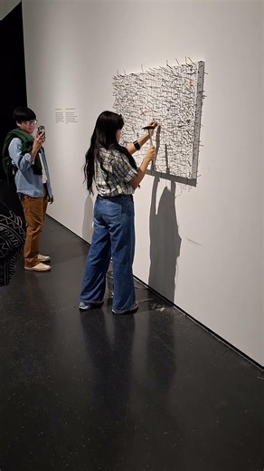People participating in Yoko Ono Painting to Hammer a Nail at MCA Chicago, 2/15/25