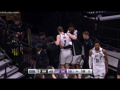 Danny Wolf lands on his teammate, rolls his left ankle and helped to the locker room, did not return