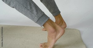 Yoga man balancing the body in balance in the room