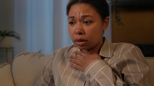 Scared African American woman alone at night evening home anxious female girl shocked confused lady feel panic attack heart disease psychological health breathing problem asthma suffer stress fright